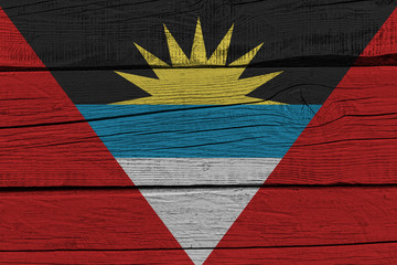 Antigua and Barbuda flag painted on old wood plank