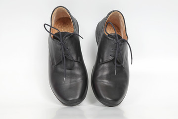 black classic shoes on white background