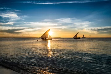 Cercles muraux Plage de Nungwi, Tanzanie Picturesque sailing boats at sunset in Zanzibar, Tanzania, Africa