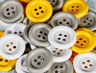 White, Grey, and Yellow Buttons