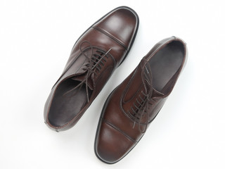 Classic men's brown shoes on white background