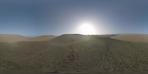 360 VR Video. Vast sandy landscape of Maspalomas Dunes with several people walking there. Man with backpack (with model release) enjoying the view from sandhill