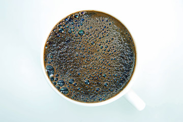 freshly brewed coffee in a Cup on white background closeup
