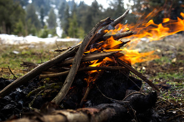 Campfire in the snowy mountains.