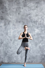 Fototapeta premium Yoga woman tree pose.