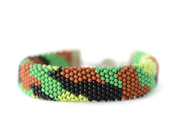 Camouflage beaded bracelet isolated on white background close up