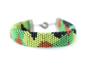 Camouflage beaded bracelet isolated on white background close up