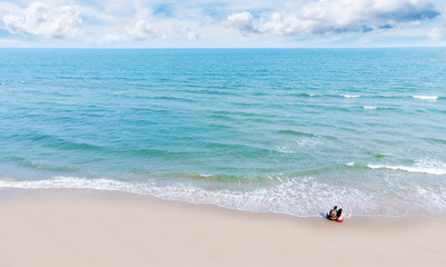 Aerial view of couples are taking selfies at beautiful beaches in Thailand.