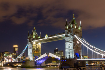 Fototapeta na wymiar Tower Bridge raised to let ship pass through. London, England