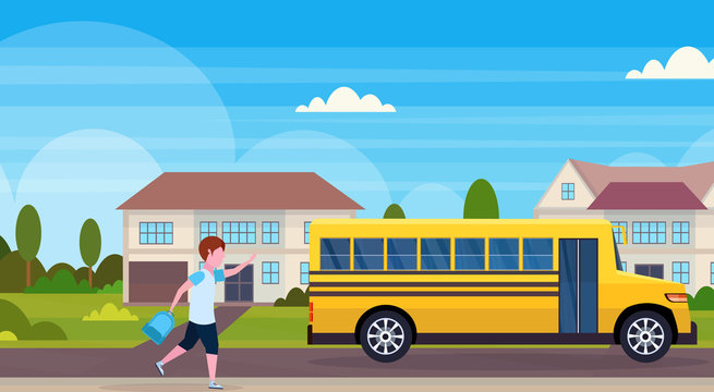 schoolboy running to chase yellow school bus pupils transport concept residential suburban street landscape background flat horizontal