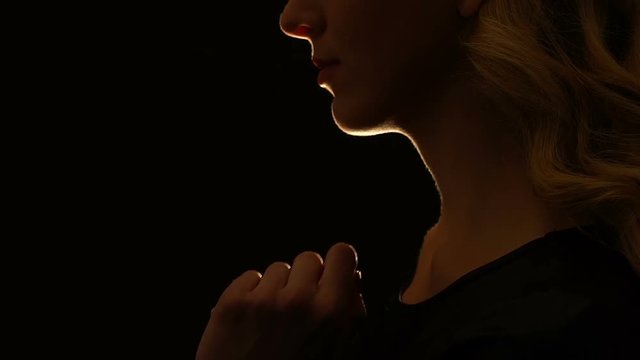 Woman showing silence gesture, taboo in sexual relations, forbidden secret love