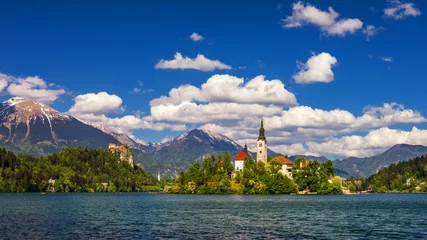 Fotobehang Lake Bled with St. Marys Church of Assumption on small island. Bled, Slovenia, Europe. The Church of the Assumption, Bled, Slovenia. The Lake Bled and Santa Maria Church near Bled, Slovenia. © daliu