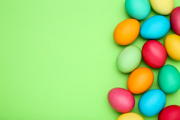 Colorful easter eggs on green background