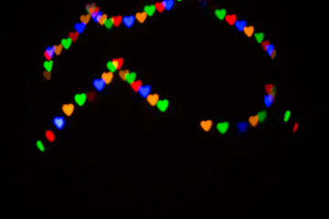 Colorful abstract heart shape blured bokeh at night