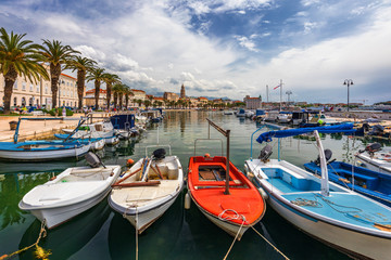 Fototapeta na wymiar City of Split with colorful fishing boats in harbor, Dalmatia, Croatia. Waterfront view of fishing boats at mediterranean scenery in old roman town Split, Croatia.