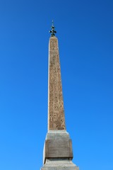 Ancient Egyptian obelisk with hieroglyphs that tell the story of