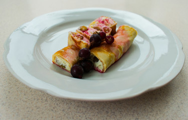  Pancakes with jam and berries on a plate