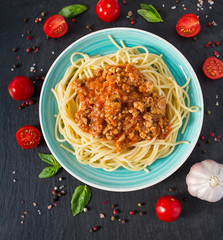 spaghetti bolognese on black surface