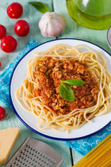 spaghetti bolognese on wooden surface