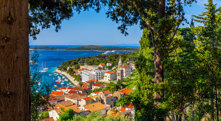 Naklejka premium View at amazing archipelago in front of town Hvar, Croatia. Harbor of old Adriatic island town Hvar. Popular touristic destination of Croatia. Amazing Hvar city on Hvar island, Croatia.