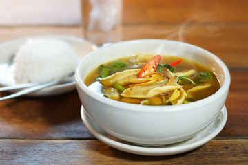 Kaeng Pa or Jungle curry is Hot&Spicy Thai curry with fish and spicy herb. Served with steamed rice, Selective focus. Still life shoot in studio, Clean food good taste idea concept.