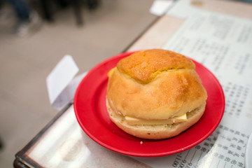 Buttered pineapple bun at cafe in Hong Kong　香港の菠蘿油（パイナップルパン）