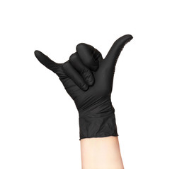 A hand in a black glove isolated on a white background shows a gesture of Shaka - the little finger...
