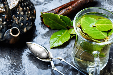 Cup of herbal tea with bay leaf