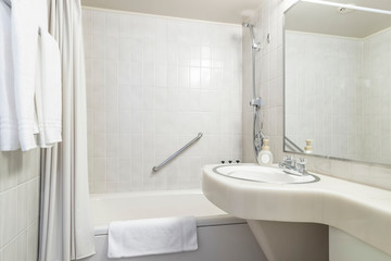 White bath tub in modern small bathroom