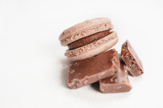 The macaroon made from chocolate and chocolate bar on isolated photo, white background  free space for text