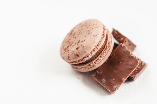 The macaroon made from chocolate and chocolate bar on isolated photo, white background  free space for text