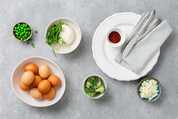 Raw ingredients cooking broccoli frittata concrete background top view