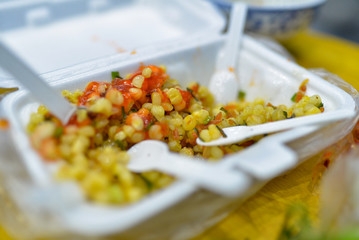 Fried corn with onion, street food in Vietnam