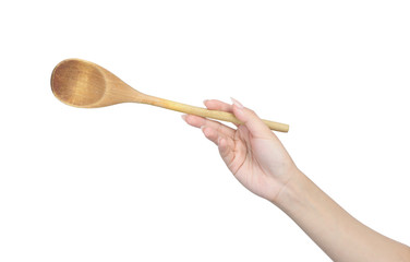 Wooden spoon in female hand