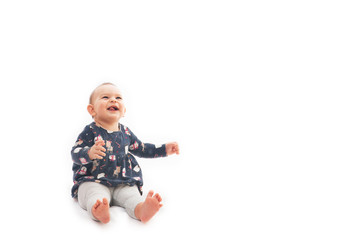 Portrait of a smilling baby girl smiling isolated on a white background childhood