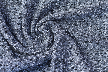 background of gray fabric, twisted into a spiral