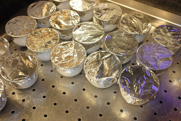 Steam egg in small bowl with wrapped with foil, Japanese food style.