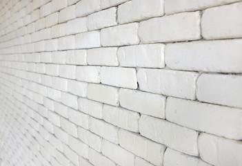 Fototapeta premium Perspective of white brick wall for texture background.