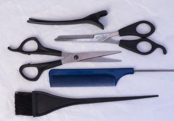 Professional hairdressing set on white table, flat composition