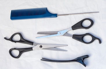 composition with professional hairdressing tools on white background, flat layer.Hair salon kit