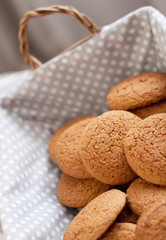 Fresh oatmeal cookies on light-colored fabric