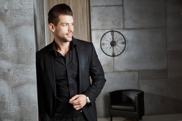 Portrait of happy young caucasian businessman