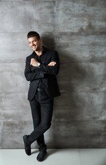 Obraz premium Portrait of handsome confident young businessman