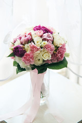 Bouquet of white, purple and pink peonies