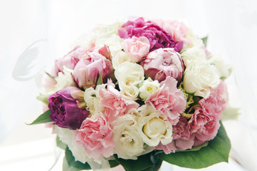 Bouquet of white, purple and pink peonies
