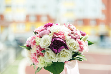 Bouquet of white, purple and pink peonies