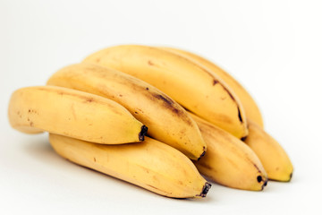 Fresh ripe Bananas on white background, vegetarian concept.