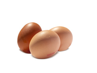three various colored eggs