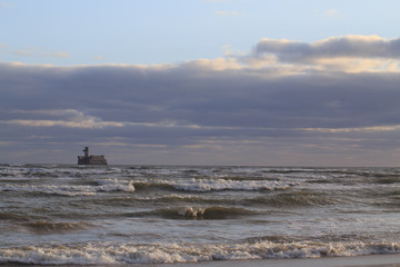 Fototapeta na wymiar sea with waves against a cloudy sky
