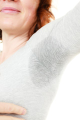 Sweaty woman wet stain under arm - obrazy, fototapety, plakaty